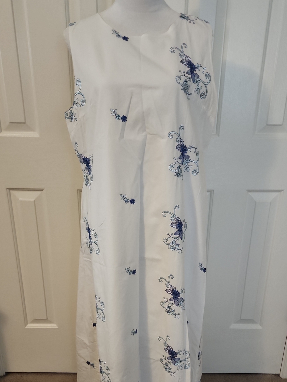 Sleeveless White Maxi Dress with Blue Floral Print